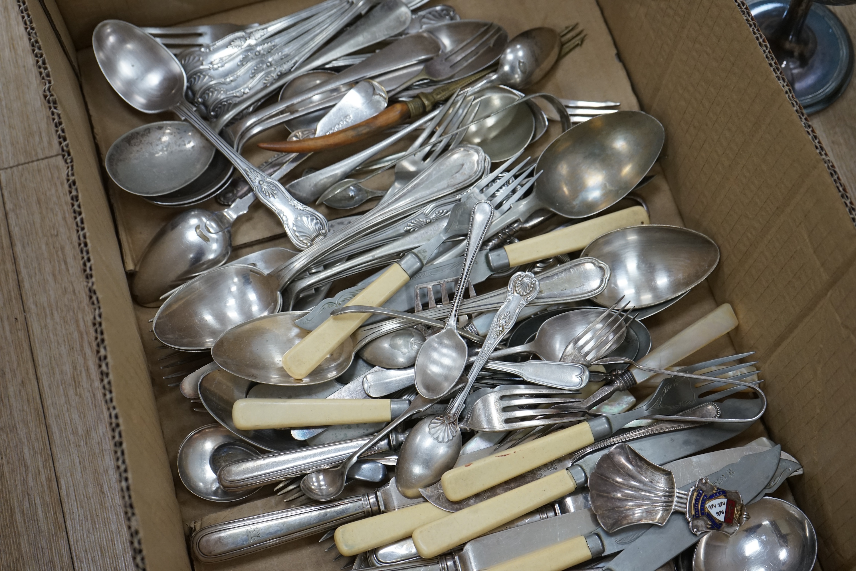 Assorted plated wares to include flatware, toast rack, biscuit barrel and goblet. Condition - fair